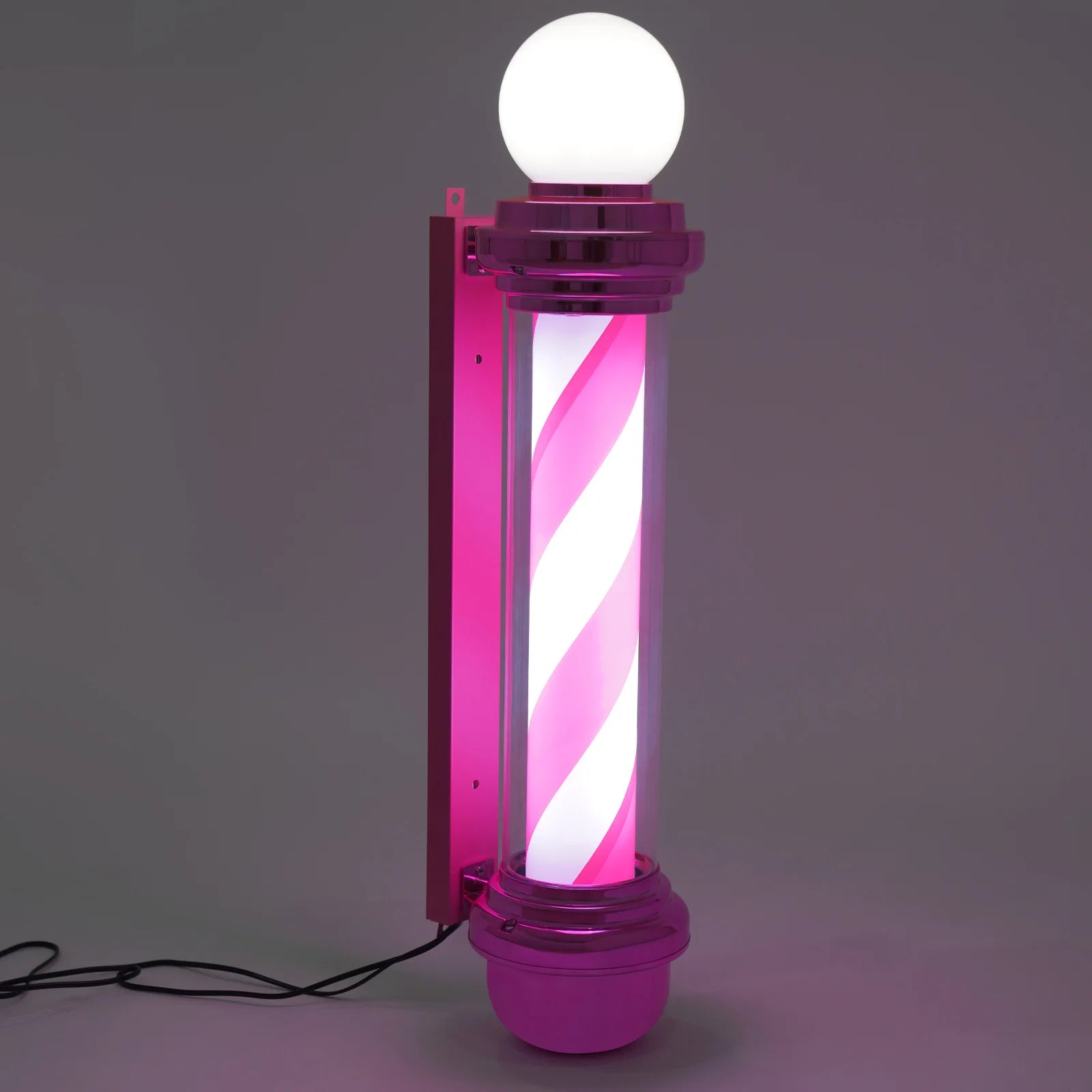 Decorative lamp with pink and white striped design on a gray background