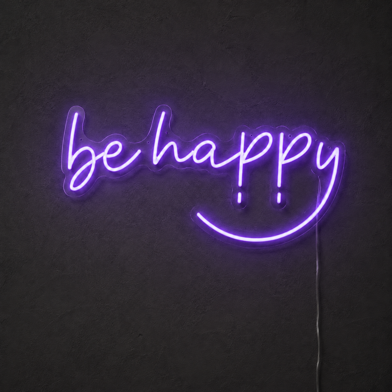 Purple Be Happy LED neon sign on a dark charcoal wall