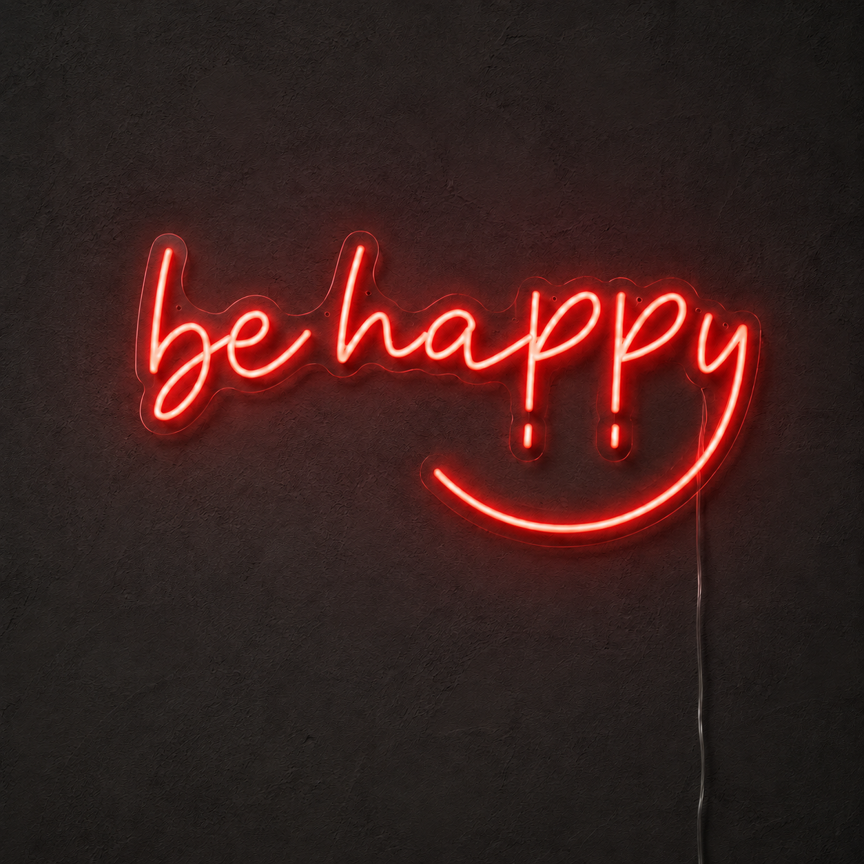 Red Be Happy LED neon sign on a dark charcoal wall