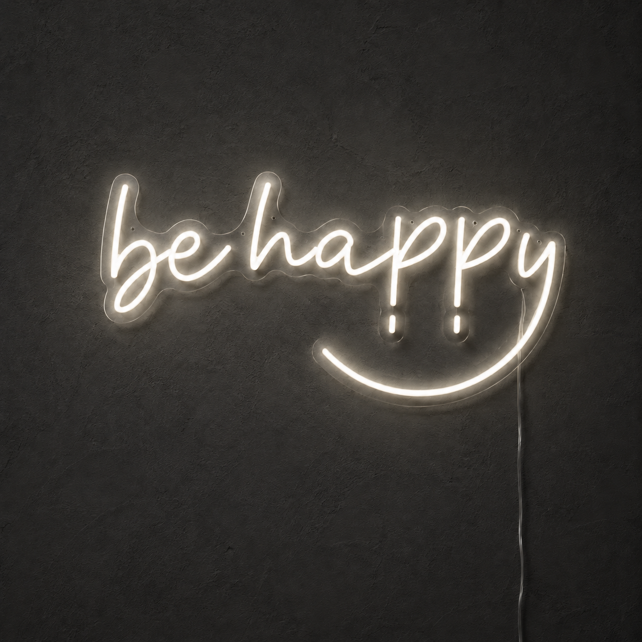 White Be Happy LED neon sign on a dark charcoal wall