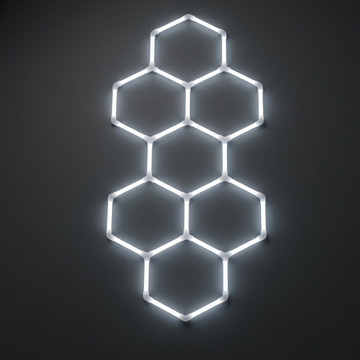 Neon hexagonal light fixture on a dark background